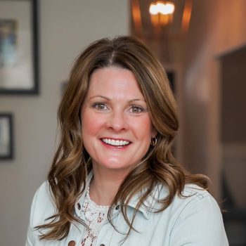 Angela Gaffney smiling inside her house